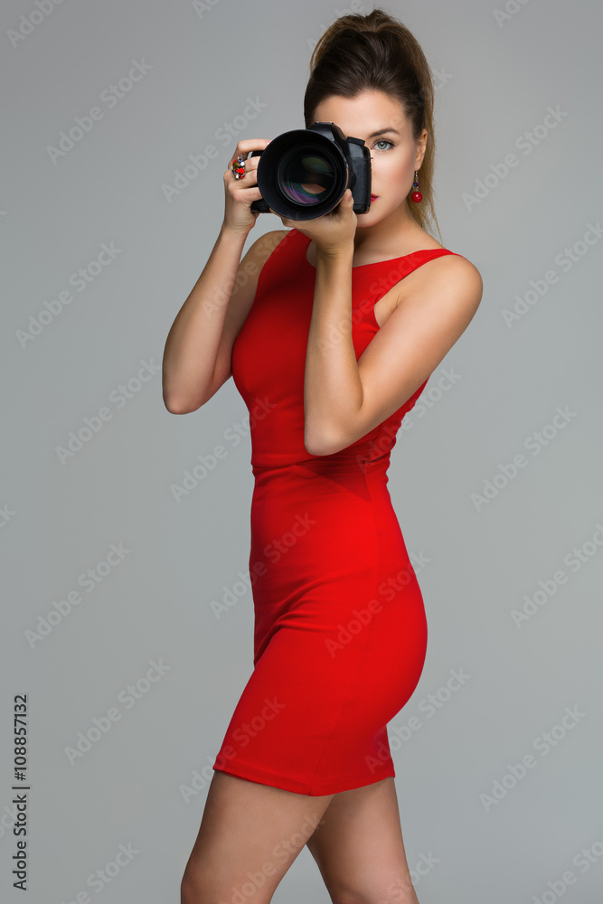 Photographer girl with dslr camera Photographer girl with dslr camera