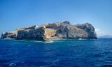 The rocky coast of the Mediterranean sea against the blue sky on a clear summer day
