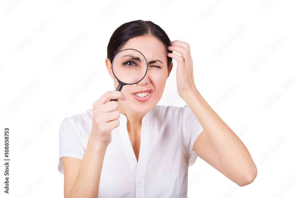 Beautiful funny girl searching with magnifier. Isolated Beautiful funny girl searching with magnifier. Isolated