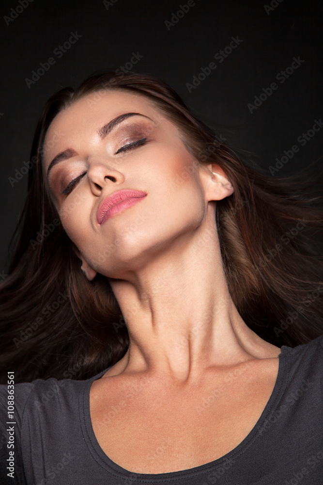 Obraz premium Portrait of a Beautiful Woman Model black background studio