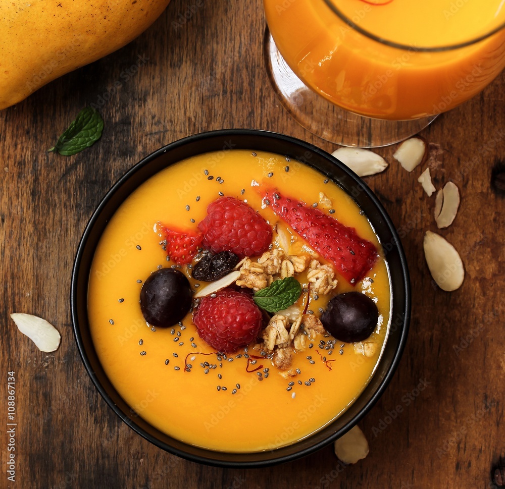 Mango smoothie bowl top down view Mango smoothie bowl top down view
