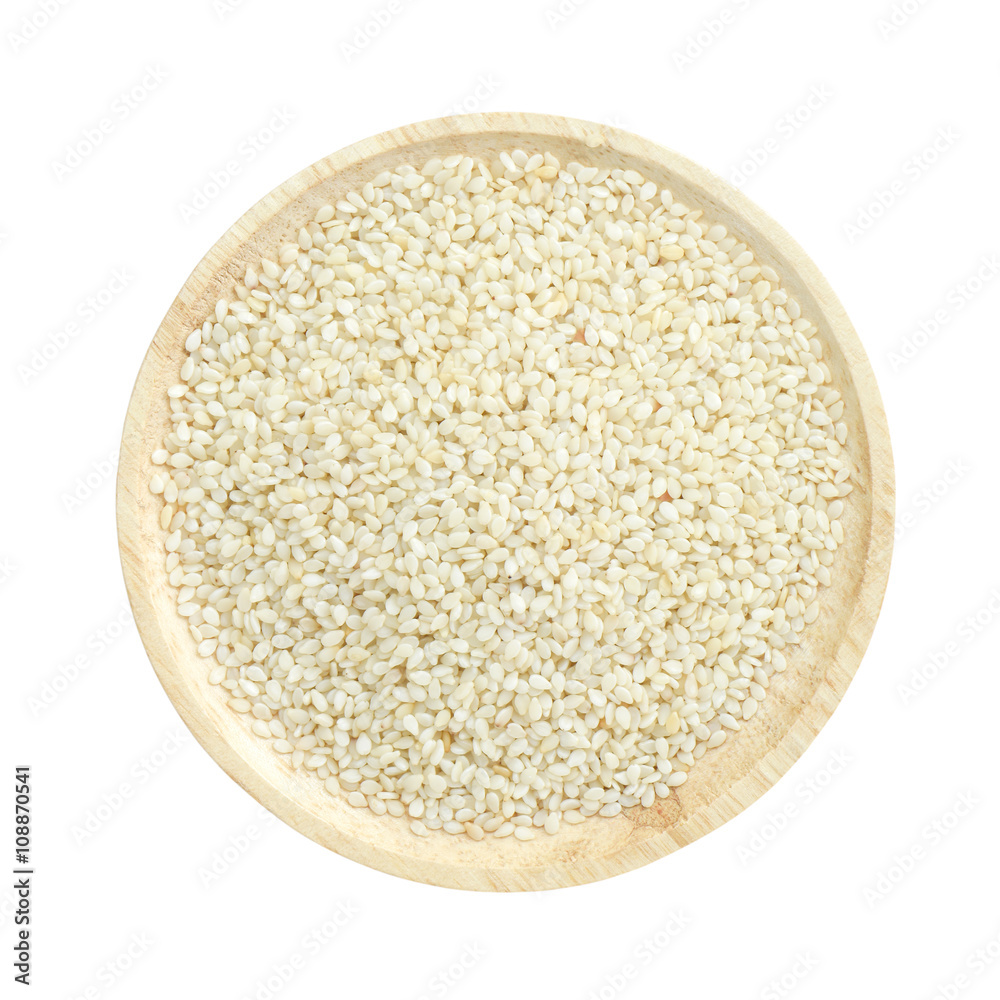 White sesame seed Ghia seed in wooden bowl isolated on white bac White sesame seed Ghia seed in wooden bowl isolated on white bac