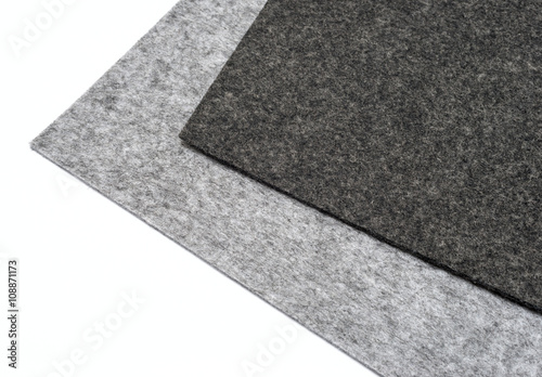 gray felt pieces on a white background.