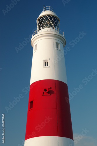 Portland Bill Lighthouse in dorset against a dark blue sky