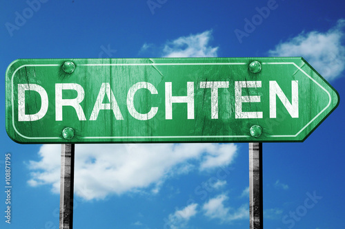 Drachten road sign, vintage green with clouds background photo