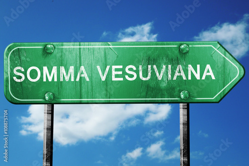 Somma vesuviana road sign, vintage green with clouds background photo