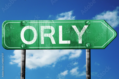 orly road sign, vintage green with clouds background photo