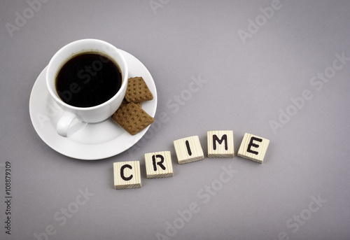 Text: Crime from wooden letters on a gray background.