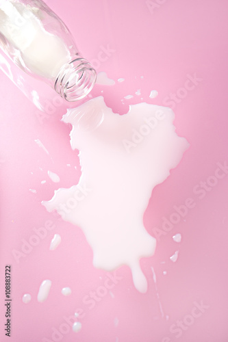 spilled milk on pink background