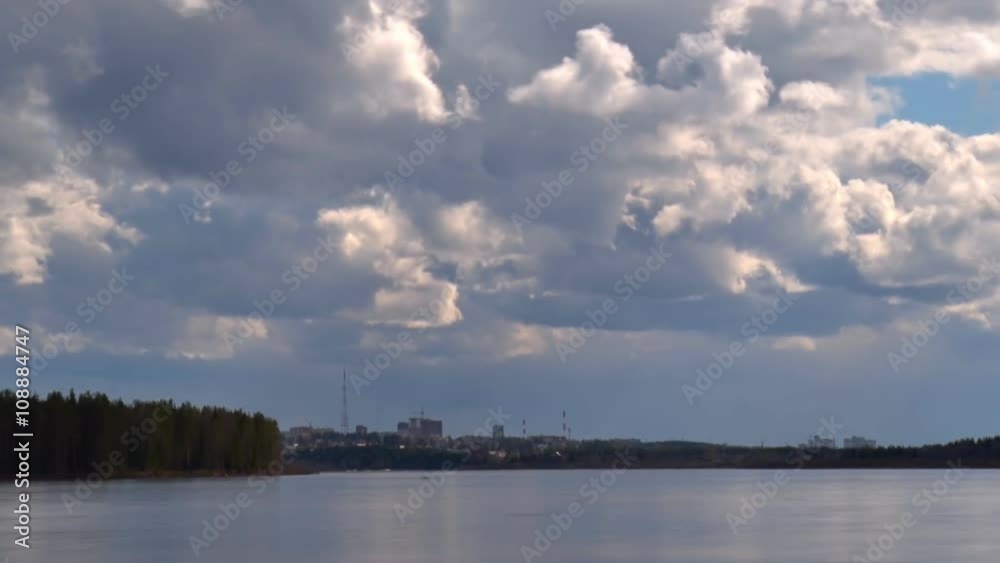 Clouds over City and River. Clouds move quickly over the city and the river. The river is moving fast. Spring, spill
Clouds over City and River. Clouds move quickly over the city and the river. The river is moving fast. Spring, spill
