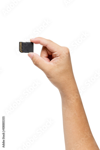 Hand holding SD card isolate on white
