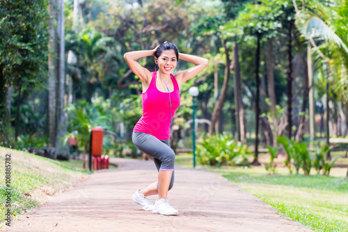 Asian Woman stretching in fitness exercise