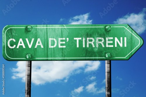Cava de tirreni road sign, vintage green with clouds background photo