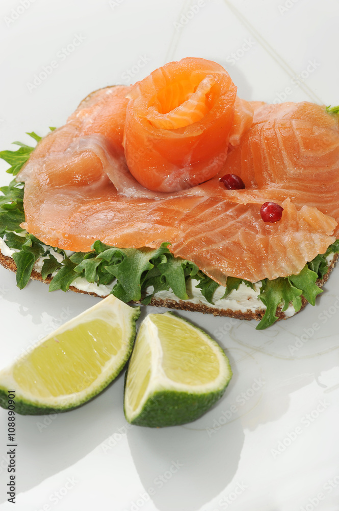 sandwiches of salmon with salad leaves