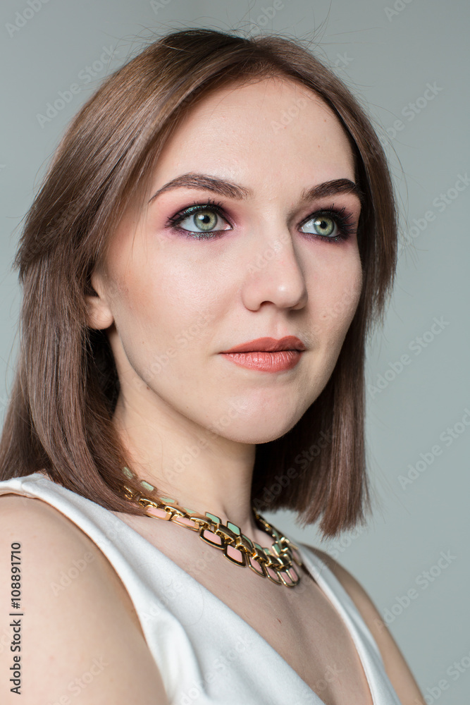 Portrait of young beautiful woman with middle length hair and smoky eyes make-up Portrait of young beautiful woman with middle length hair and smoky eyes make-up