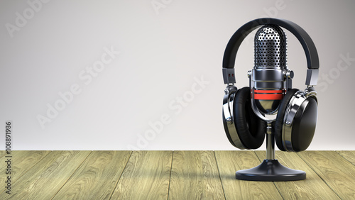 Microphone and headphones on wooden table