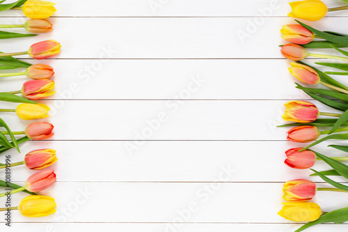 Fototapeta Naklejka Na Ścianę i Meble -  Spring background. Tulips on white wooden background. Copy space, top view