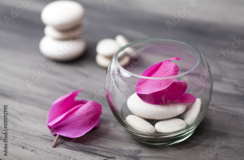 Spa still life with pink orchid, white zen stone and tea candle