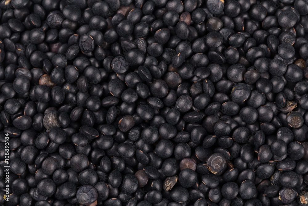 black lentils background closeup black lentils background closeup
