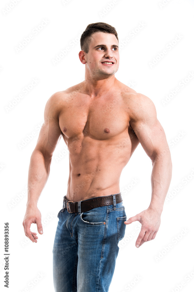 Sexy smiling shirtless male model with muscular body and abs against isolated white background looking outside Sexy smiling shirtless male model with muscular body and abs against isolated white background looking outside