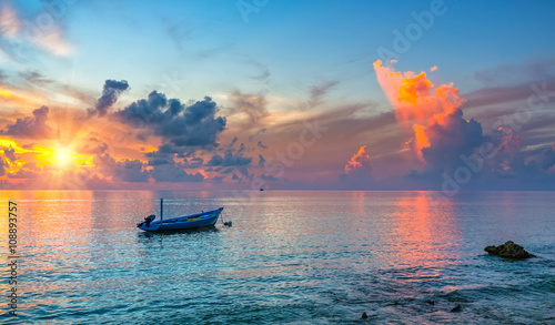 Colorful sunrise over ocean on Maldives