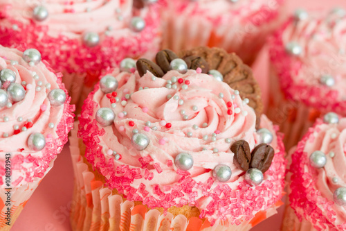 Closeup of pink cupcakes with sprinkles photo