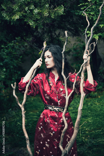 woman in kimono in garden