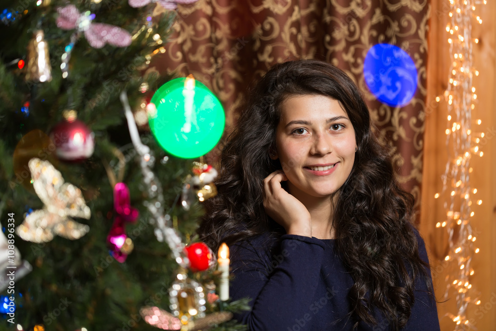 Smiling girl with Christmas tree Smiling girl with Christmas tree