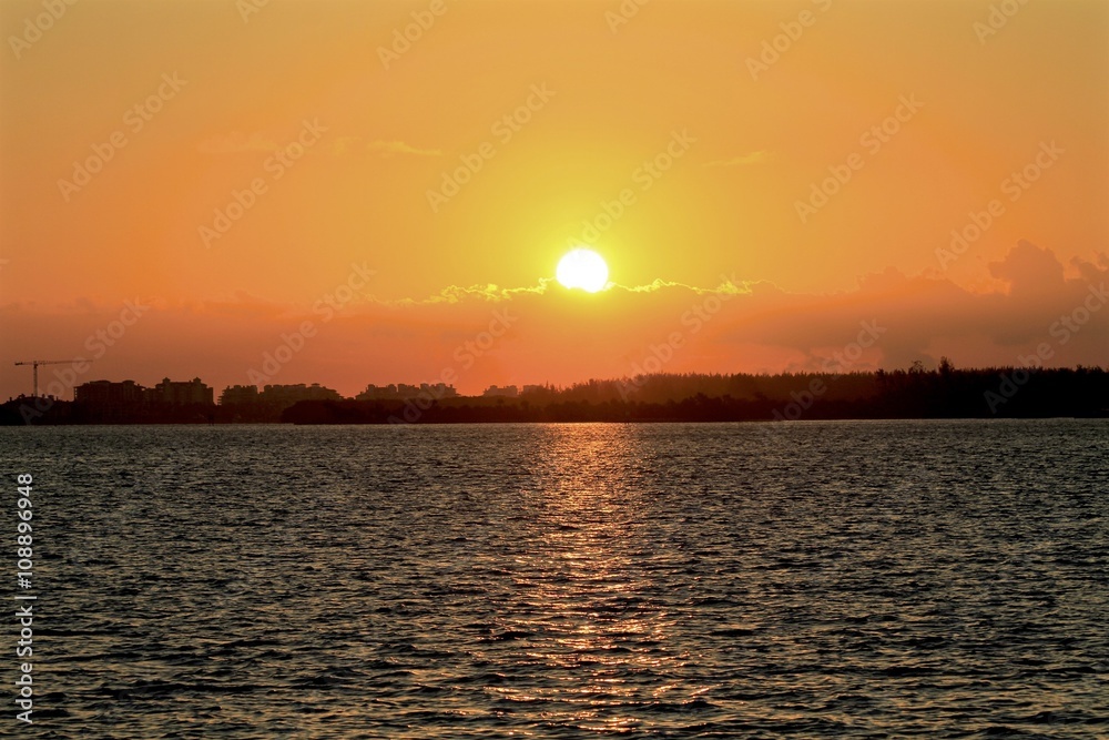 Golden sunrise lights from Rickenbacker bay, miami florida