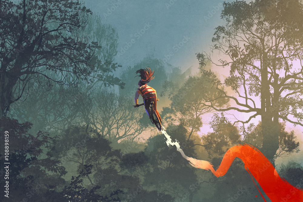 Fototapeta premium cyclist riding a bike with tire track in the air with forest in background