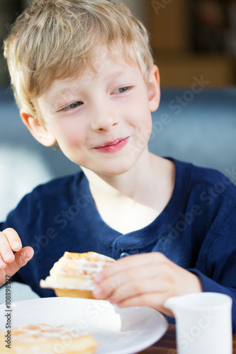kid eating waffles