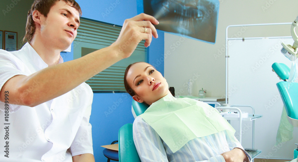 Young woman with dentist in a dental surgery. Healthcare Young woman with dentist in a dental surgery. Healthcare