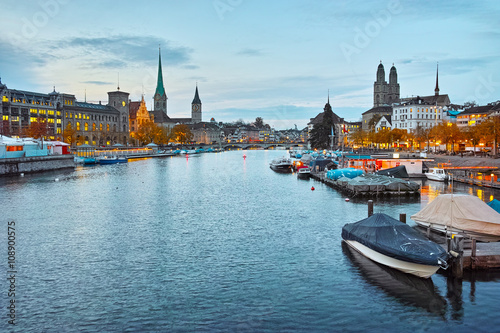 Sunset panorama of city of Zurich and reflection in Limmat River  Switzerland
