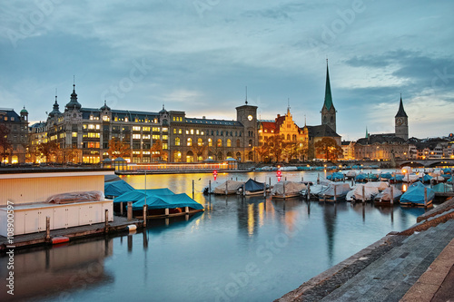 Night panoramic photo of city of Zurich and reflection in Limmat River, Switzerland