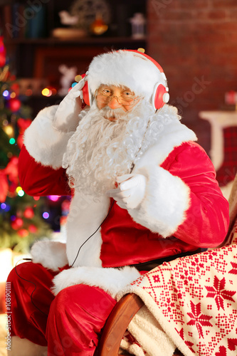 Santa Claus sitting with he...