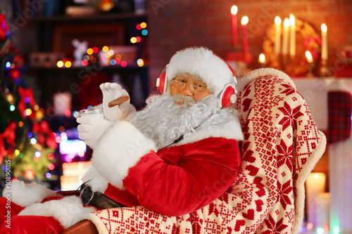 Santa Claus sitting with he...