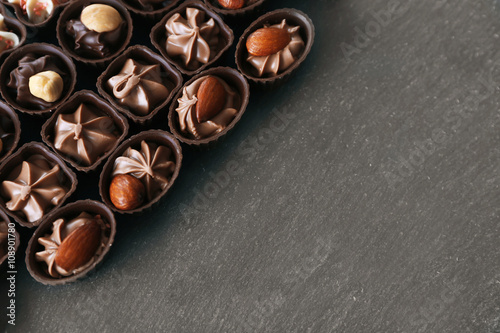 Chocolate sweets on wooden background © Africa Studio