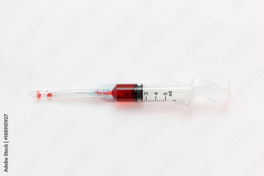 Fototapeta premium Red medicine syringe
