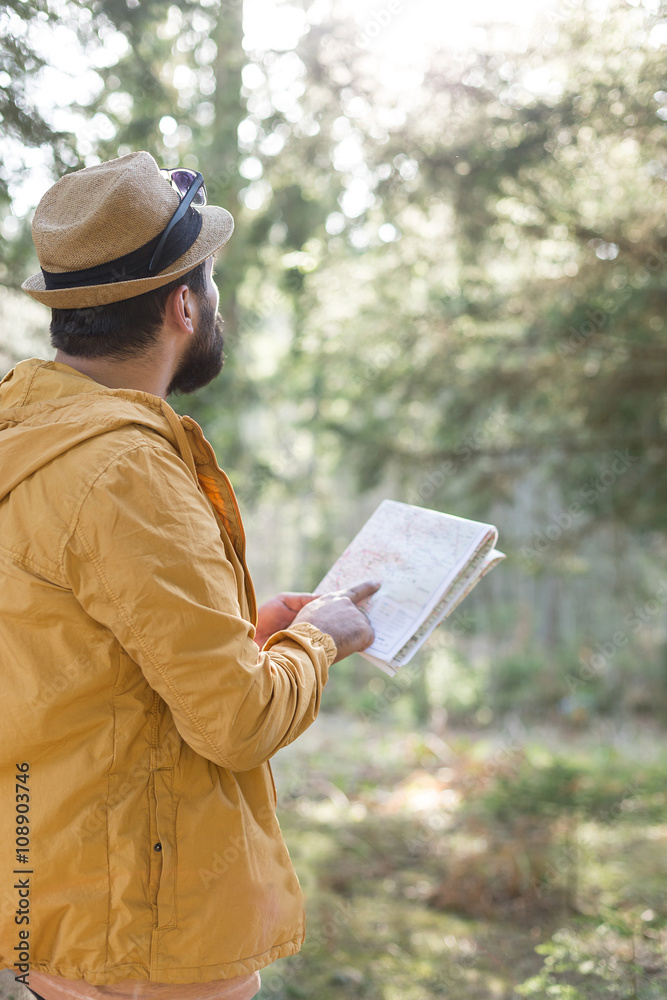 Hiker in nature. man in nature using map