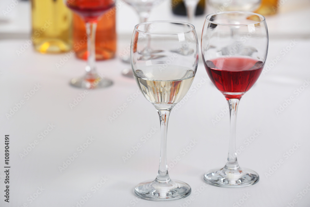 Wine glasses with red and white wine, closeup Wine glasses with red and white wine, closeup