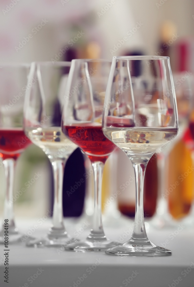 Wine glasses with red and white wine, closeup Wine glasses with red and white wine, closeup