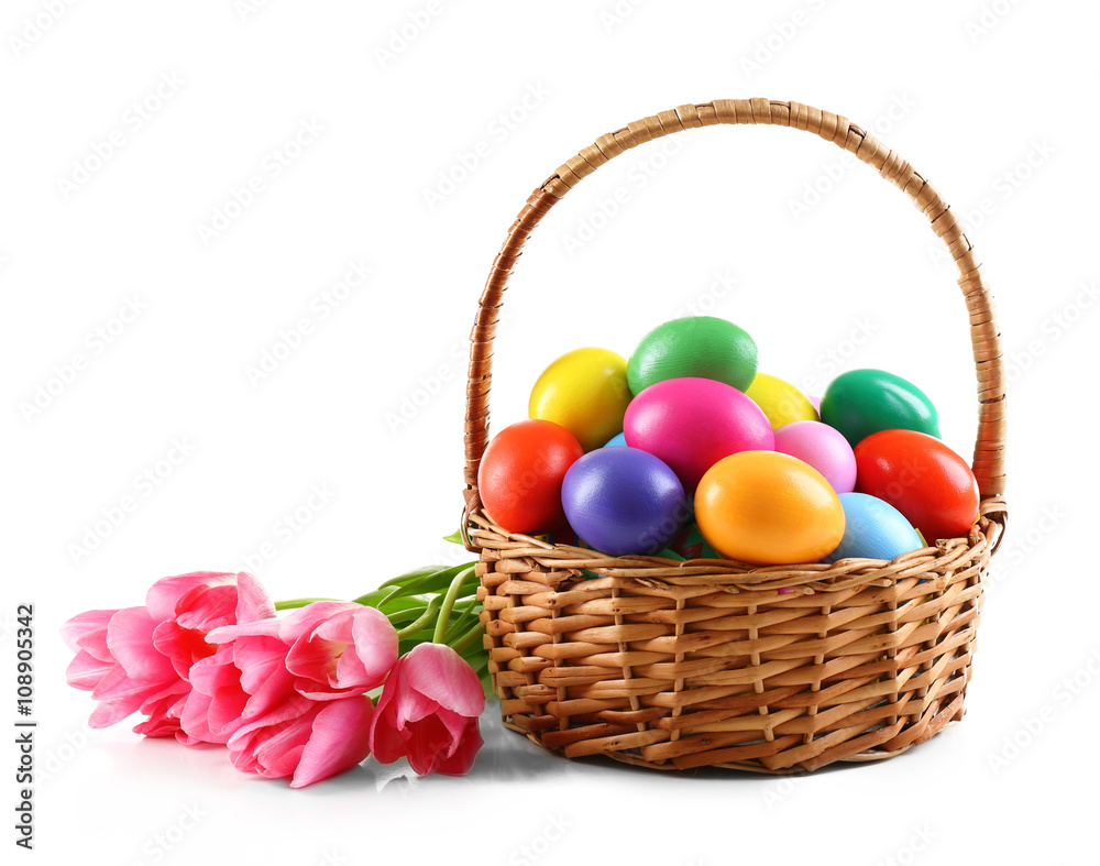 Multicoloured Easter eggs in basket isolated on white Multicoloured Easter eggs in basket isolated on white