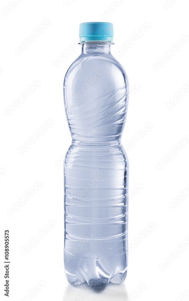 Bottled water on the grey background, close up Bottled water on the grey background, close up