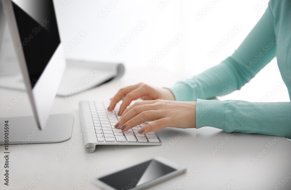 Woman working with computer at home or at office Woman working with computer at home or at office