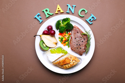 Traditional French lunch on brown background