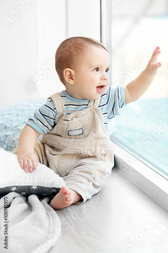 Little baby boy looking out...
