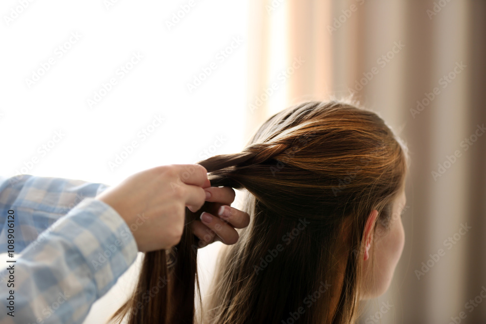 Woman making braids Woman making braids