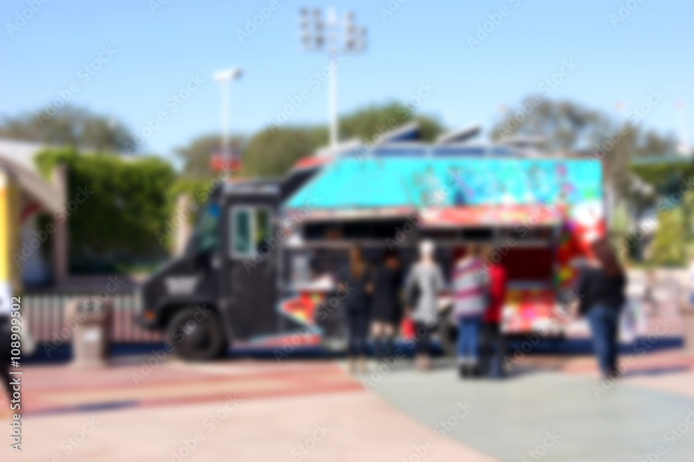 blurred background of people ordering at food truck blurred background of people ordering at food truck
