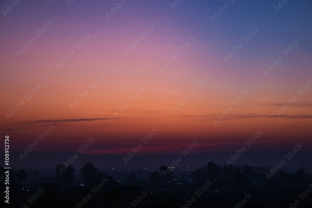Silhouette, tropical city in dawn with sunrise in Chiang Mai city, Thailand