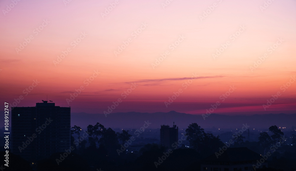 Silhouette, tropical city in dawn with sunrise in Chiang Mai city, Thailand